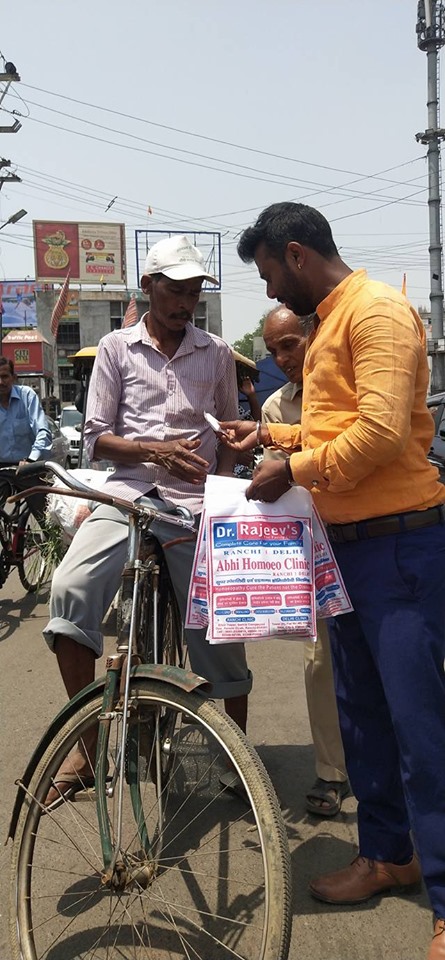 Distributing Sunstroke Medicine, water Bottles, Towels, and Health Tonic to all Traffic Police, Rickshaw Drivers, Automobiles, and common people.