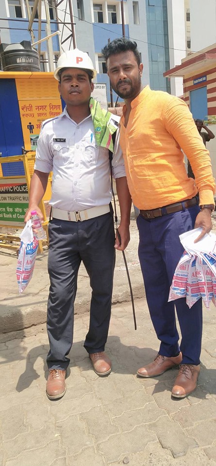 Distributing Sunstroke Medicine, water Bottles, Towels, and Health Tonic to all Traffic Police, Rickshaw Drivers, Automobiles, and common people.