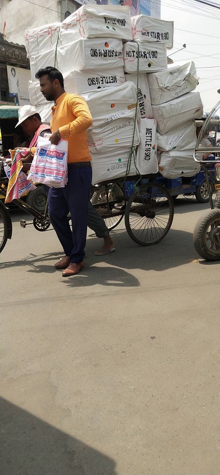 Distributing Sunstroke Medicine, water Bottles, Towels, and Health Tonic to all Traffic Police, Rickshaw Drivers, Automobiles, and common people.