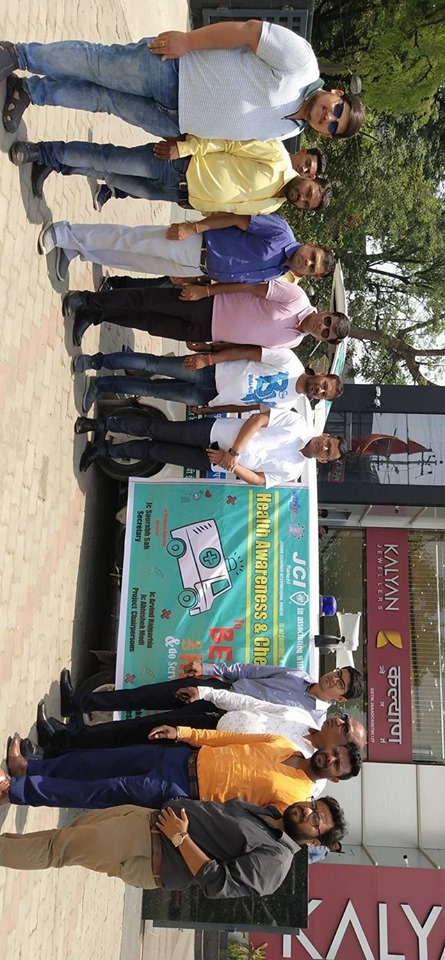 Distributing Sunstroke Medicine, water Bottles, Towels, and Health Tonic to all Traffic Police, Rickshaw Drivers, Automobiles, and common people.