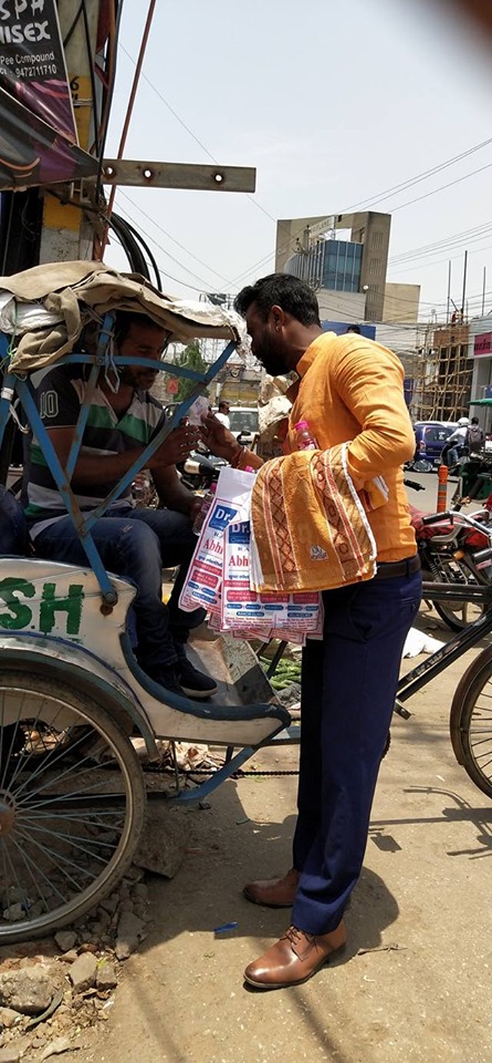 Distributing Sunstroke Medicine, water Bottles, Towels, and Health Tonic to all Traffic Police, Rickshaw Drivers, Automobiles, and common people.
