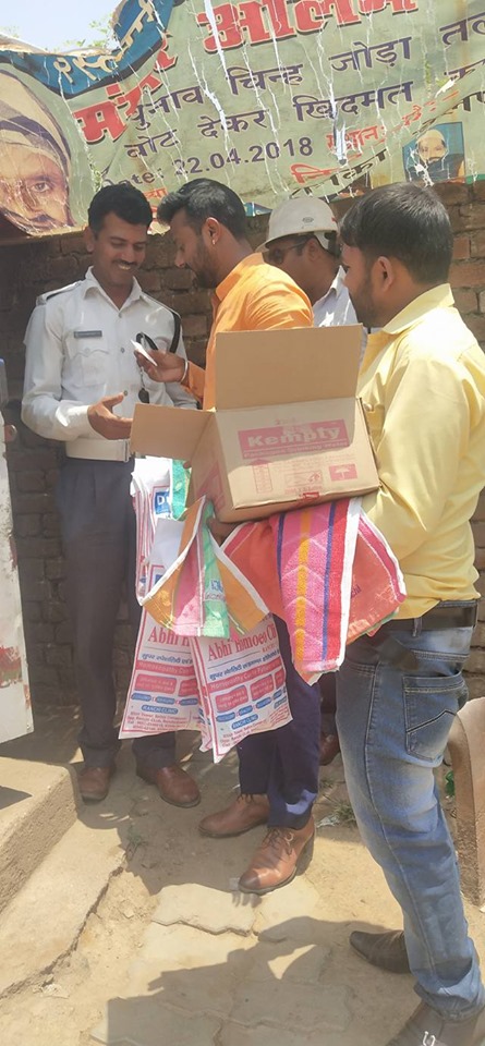 Distributing Sunstroke Medicine, water Bottles, Towels, and Health Tonic to all Traffic Police, Rickshaw Drivers, Automobiles, and common people.