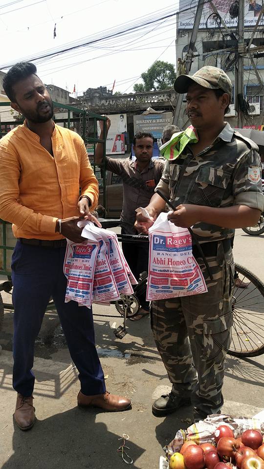 Distributing Sunstroke Medicine, water Bottles, Towels, and Health Tonic to all Traffic Police, Rickshaw Drivers, Automobiles, and common people.